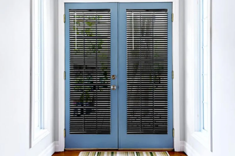 Custom faux wood blinds on a window in an Oklahoma City home
